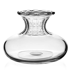 The Debbie Flower Vase by William Yeoward Crystal features hand-made clear glass, a wide round base, short ridged neck, and flared wavy rim—perfect as a floral table centrepiece.