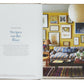 Open book showing Chapter Seven titled "Stripes on the Bias" from FREDERIC magazine. On the right page is a colorful living room with a striped sofa, various framed pictures on the yellow wall, and "Decorate Like A Decorator" by Phaidon showcasing clever designer tricks and decorating tips.