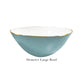 A large bowl from Beatriz Ball's Encanto Turquoise Serveware Collection featuring a teal enameled exterior, white interior, and a slim gold rim. Below it reads "Demeter Large Bowl.