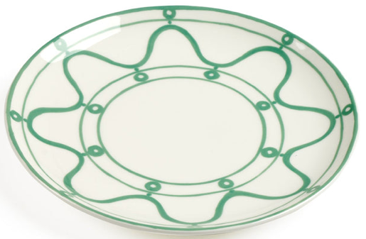A white ceramic plate from Themis Z’s Serenity Green Dinnerware Collection, featuring organic green abstract circular and wavy line patterns along the rim and center.