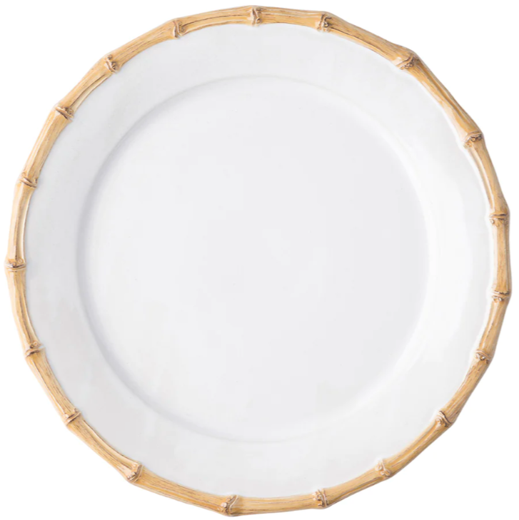 A white ceramic plate with a light brown bamboo-style rim from Juliska’s Classic Bamboo Dinnerware Collection, photographed from above on a white background, exudes casual elegance and global charm.