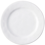 The Puro Whitewash Dinnerware Collection by Juliska features a plain, round white ceramic plate—perfect for any neutral palette and ideal for serving savory tapas or teatime treats.