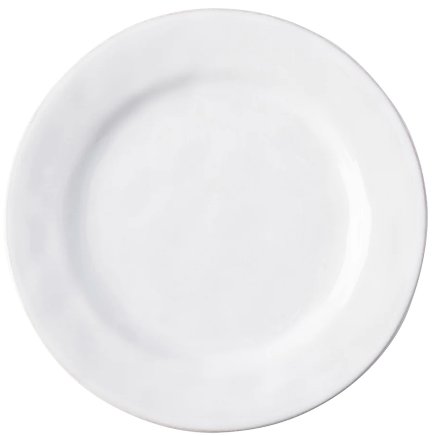 The Puro Whitewash Dinnerware Collection by Juliska features a plain, round white ceramic plate—perfect for any neutral palette and ideal for serving savory tapas or teatime treats.