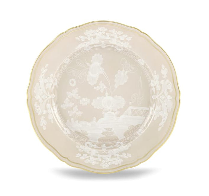 A round porcelain plate from Ginori 1735’s Oriente Italiano Meringa Dinnerware & Serveware Collection, featuring a scalloped edge, gold trim, and white floral and landscape patterns at the center and border.