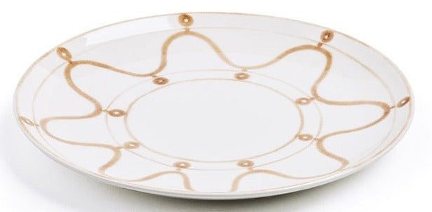 Themis Z Serenity Beige Dinnerware Collection: a white ceramic handcrafted dinner plate with a tan wavy Serenity pattern and circular accents, artfully hand-painted around the rim.