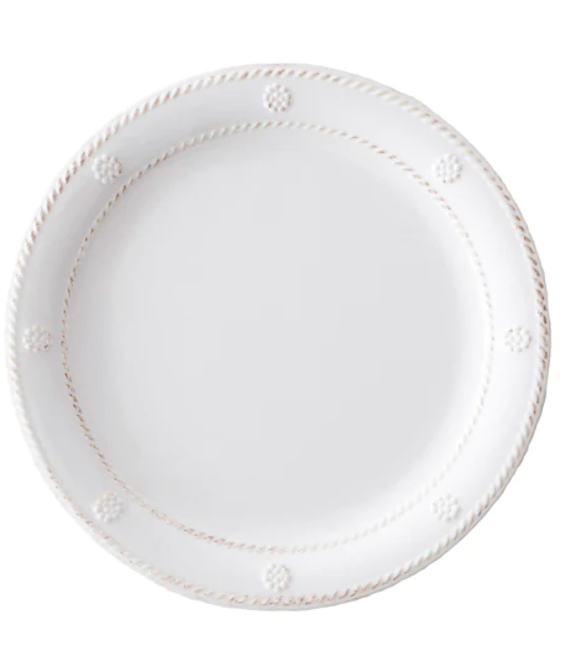 The Berry & Thread Melamine Whitewash Dinnerware Collection by Juliska features a white plate with a raised edge and signature rope-like motif around the rim—perfect for adventurous entertainers.