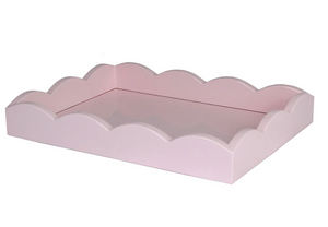 The Scalloped Edge Lacquer Tray in Pale Pink by Addison Ross is a shallow rectangular tray with scalloped edges, shown against a white background. This elegant piece adds charm and sophistication to any setting.