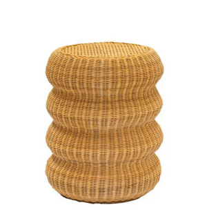 The Maggie Side Table from the Varnish Collection is a round, tiered light-brown wicker piece with three curved sections stacked vertically, offering vintage style against a plain white background.