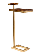 The Edgar Drinks Table by Made Goods features a gold metal frame, rectangular base, and a high gloss faux tortoise-patterned wooden top with a matching handle.