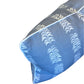 Close-up of the Hive Custom Pillows Petite Frond Blue Lumbar Pillow, featuring a white leaf pattern and white piping for an elegant, premium look.