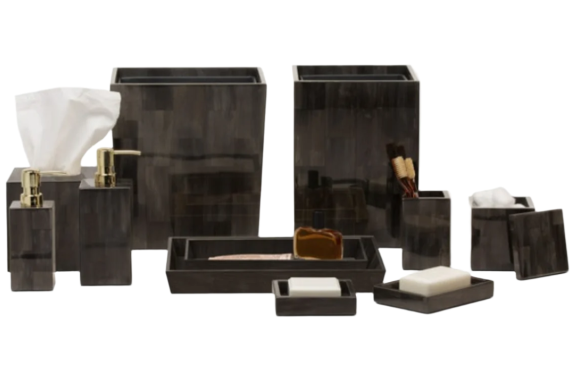 The Arles Bath Collection by Pigeon & Poodle—featuring tissue box, pump dispensers, trays, toothbrush holder, soap dish, and waste bin—is elegantly displayed on a white backdrop.