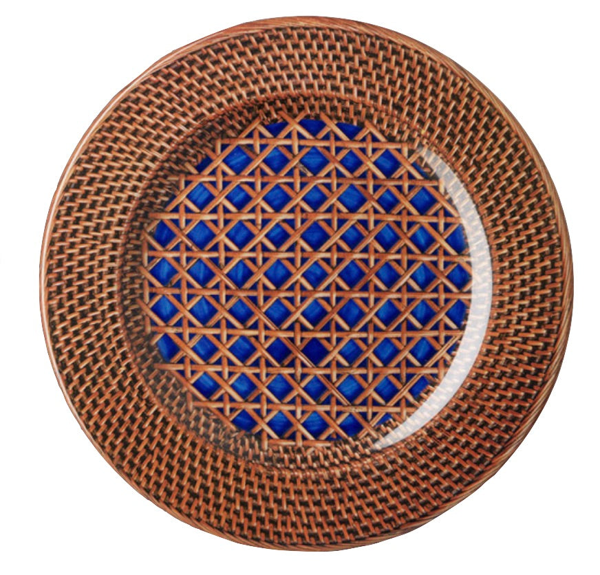 The Patagonia Blue Melamine Dinnerware Collection by Mario Luca Giusti features a round plate with a woven brown rim and blue geometric lattice center, uniting antique charm and modern style.