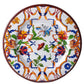 The Pancale White Melamine Dinnerware Collection by Mario Luca Giusti features a Florence-inspired design with vibrant red, orange, blue, and green floral and geometric patterns on a white background.