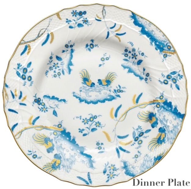 Ginori 1735 Oro Di Doccia Turchese Dinnerware Collection: White porcelain dinner plate featuring blue, yellow floral and Ji Ondori roosters motif with hand-painted gold trim on a scalloped edge; "Dinner Plate" text at lower right.