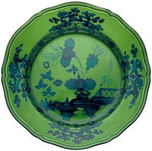 A decorative green plate with blue floral patterns and scalloped edges, viewed from above, from the Oriente Italiano Malachite Dinnerware Collection by Ginori 1735.