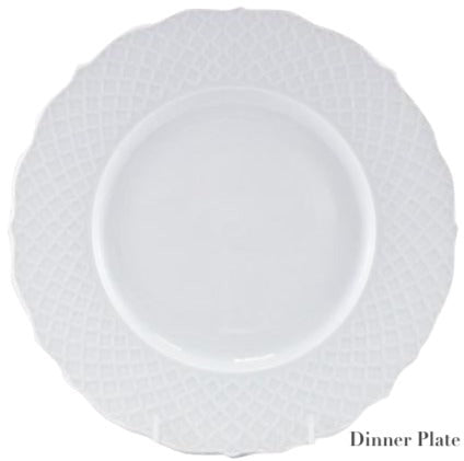A white porcelain dinner plate from the Empire White Dinnerware Collection by Anna Weatherley, featuring a textured rim, is displayed against a plain background. "Dinner Plate" appears in the lower right corner. Made in Portugal.