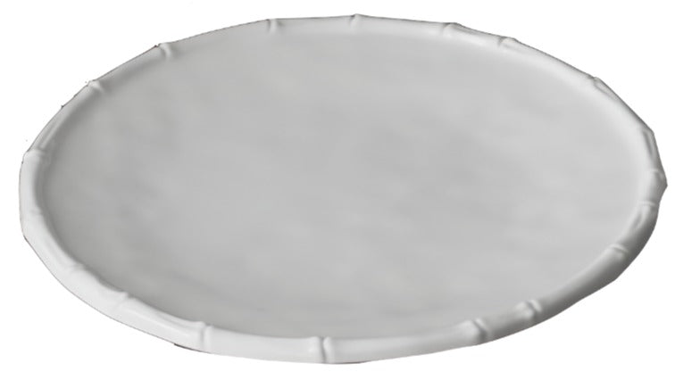 A round, white plate from the Beatriz Ball Vida White Bamboo Dinnerware Collection features a slightly raised, textured rim and is photographed against a white background.