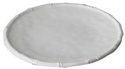 A round, white plate from the Beatriz Ball Vida White Bamboo Dinnerware Collection features a slightly raised, textured rim and is photographed against a white background.