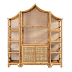 The Lainey 3 Piece Bookcase Set by Made Goods is a spacious bamboo shelving unit with a distinctive pagoda-inspired silhouette, showcasing open side shelves, a woven cane back, and two central cabinet doors at the bottom—a stunning statement centerpiece for any room.