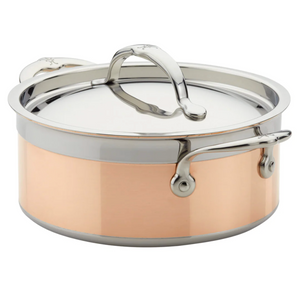 The Hestan CopperBond Copper Induction Soup Pot, 3qt, features stainless steel and copper construction, two handles, a lid, is oven safe, and sits elegantly on a white background.