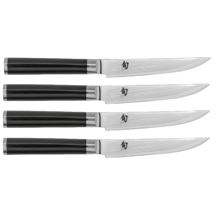 A set of four steak knives from the Shun Classic Ebony series, featuring black handles and gleaming, razor-sharp steel blades, arranged in parallel.