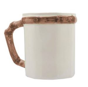 The Les Ottomans Bamboo Mug is a white ceramic coffee mug with a brown bamboo-style handle and rim, hand-painted to add nature-inspired charm to your drinkware collection.