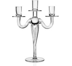 The Gaby Crystal Candelabra by William Yeoward Crystal is a clear glass, three-arm candelabra with a central stem and round base—handmade to hold three candles and perfect as an elegant dining table centerpiece.