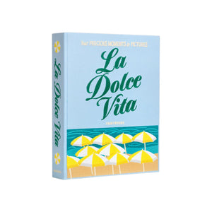 The La Dolce Vita Photo Album by PrintWorks features yellow and white beach umbrellas on a light blue cover—ideal for storing memories or displaying as decor.