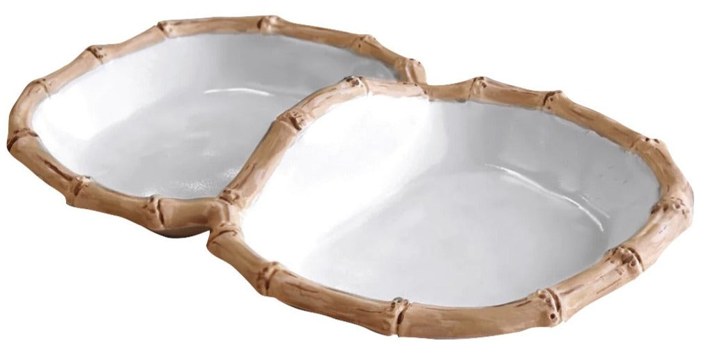 Two connected white serving bowls from the Vida Natural Bamboo Serveware Collection by Beatriz Ball feature bamboo-inspired rims. Made of luxury melamine, they are break resistant and perfect for stylish entertaining.