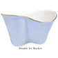 A light blue double ice bucket from Beatriz Ball's Encanto Periwinkle Serveware Collection, crafted from aluminum alloy with a wavy shape, white enameled interior, and gold rim, labeled "Double Ice Bucket" below.