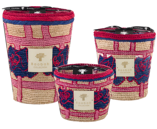 Three colorful Baobab Collection Frida Draozy Frida candles with intricate woven patterns and floral designs displayed in a staggered arrangement.