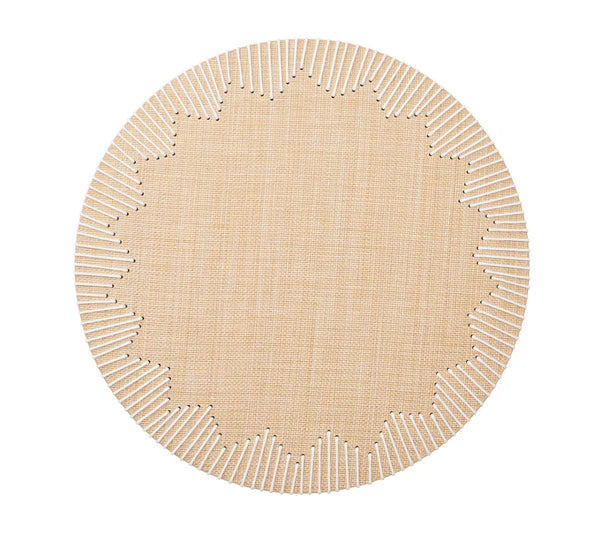 The Dream Weaver Placemat by Kim Seybert features a round, light tan woven design with white-stitched, starburst-style jagged edges—ideal for summer entertaining.