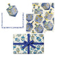 Celebrate Hanukkah and festive occasions with the Caspari Patterned Dreidel Collection gift wrap set, featuring elegant blue and gold dreidel designs. This set includes decorative patterned paper, a matching motif card, and a beautifully wrapped box finished with a blue ribbon—perfect for sharing gifts after enjoying delicious latkes.