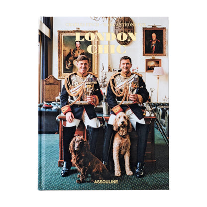 Two men in ornate uniforms and two dogs sit in an elegant room, reflecting iconic London style on the cover of Assouline's "London Chic.