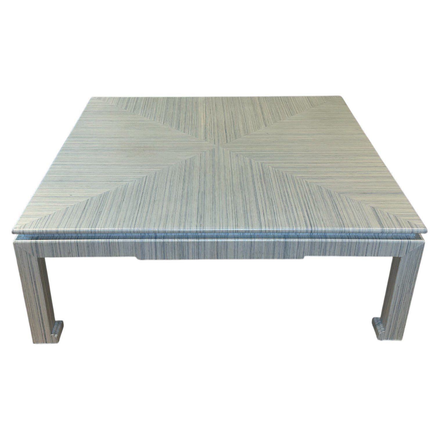 The CFW-21 Custom Cocktail Table by T3 Custom Furniture features a light wood finish and geometric surface pattern with straight, right-angle legs—ideal for modern spaces. Pairs perfectly with Soho Hemp Blue and Gray décor.
