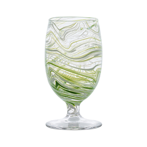 The Puro Marbled Drinkware Collection by Juliska features a clear glass goblet with green and white seaglass-inspired swirls, set on a short stem and round base, displayed against a plain white background.