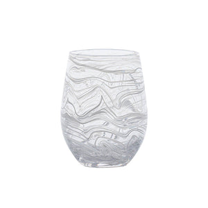 The Juliska Puro Marbled Drinkware Collection features a clear glass tumbler with a rounded shape and swirling, wavy etched patterns, displayed against a white background.