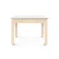 The Villa & House Bethany Game Table is a square wooden table with a light finish, glass top, and four curved legs. Set against a plain white background, this versatile piece blends style and function for any space.