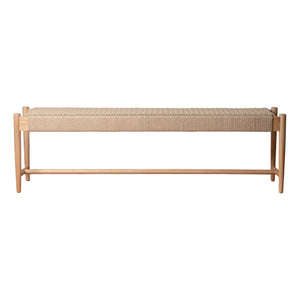 The Ingrid Woven Bench by Selamat features a light wood Scandinavian frame and a hand-woven beige loom seat, displayed against a white background.