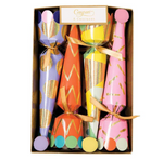 A box of eight Caspari Party Hats Celebration Crackers in assorted colors and patterns with metallic details, each tied with a gold ribbon and topped with a pom-pom—perfect as holiday party favors or classic Christmas crackers.