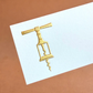 The Printery Gold Corkscrew Place Card Set features white tented cards with a gold corkscrew illustration on a brown background.