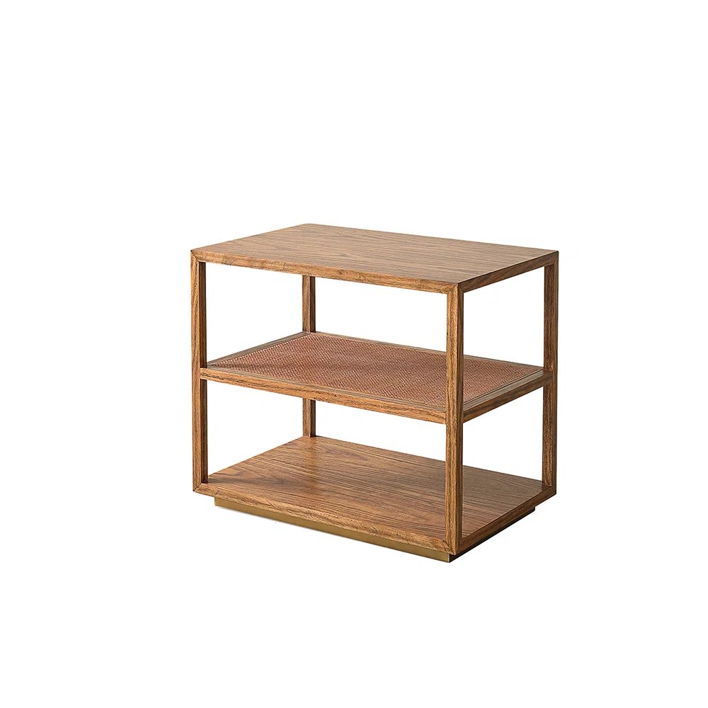 The Orca Side Table by Julian Chichester is a three-tiered rectangular wooden shelf unit with open sides, showcasing a natural wood grain finish and featuring an antiqued rattan shelf detail, isolated on a white background.