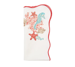 The Kim Seybert Marina Napkin Set features white cloth napkins with red trim and embroidered seahorse, starfish, coral, and seashells—perfect for adding a coastal touch to your table.