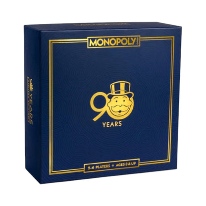 Celebrate with the Monopoly 90th Anniversary Edition by WS Game Company—a collectible set in a dark blue box with gold accents, ideal for 2–6 players ages 8 and up.