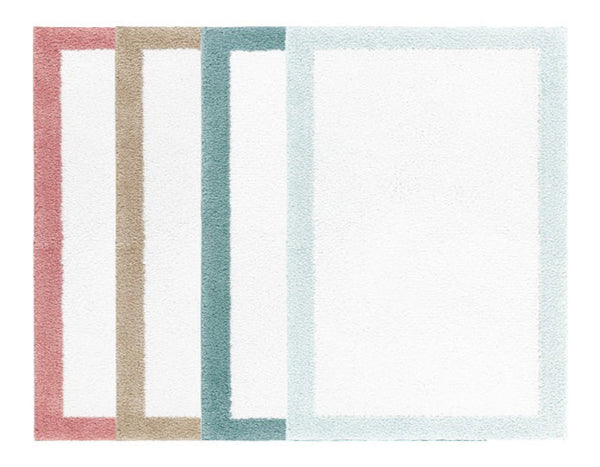 The Graccioza Egoist Border Bath Rug by Graccioza features four overlapping white rugs with pink, beige, teal, and light blue borders, crafted from luxurious Egyptian cotton.