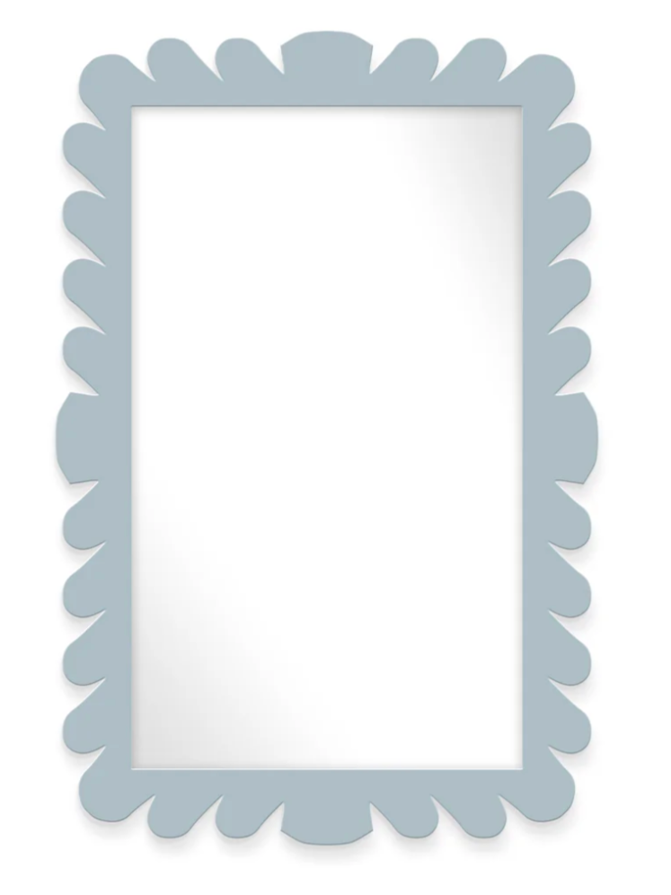 The Fleur Home Garden District Coquette Rectangle Mirror in Denim Wash features a light blue scalloped frame inspired by New Orleans' Queen Anne fishtail shingles and a clear, plain reflective surface.
