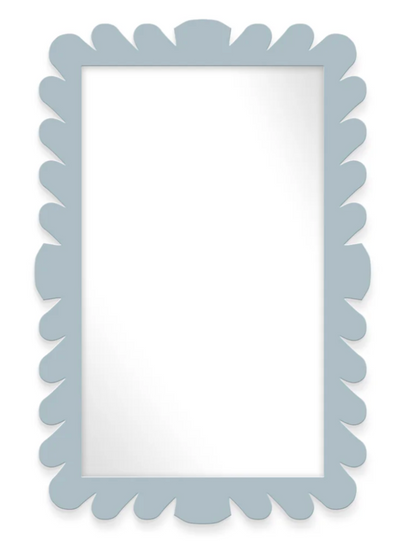The Fleur Home Garden District Coquette Rectangle Mirror in Denim Wash features a light blue scalloped frame inspired by New Orleans' Queen Anne fishtail shingles and a clear, plain reflective surface.