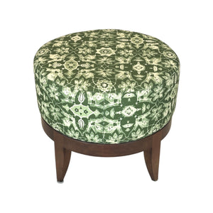 The Auburn Small Stool by Hickory Chair features a modern silhouette with a green and beige patterned cushioned top and wooden legs, providing versatile seating. Shown on a white background.