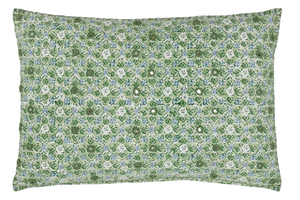 The Ankur Kidney Pillow by John Robshaw is a rectangular green pillow featuring blue and white hand-printed medallions, smiley faces, and playful patterns for a cheerful accent.