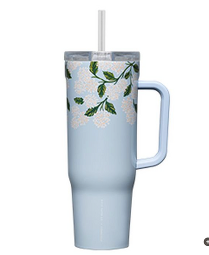 The Blue Hydrangea Cruiser by Rifle Paper Co. is a tall, light blue 40-oz straw cup with a handle, floral design near the top, triple insulation for lasting chill, a spill-proof lid, and a transparent straw.
